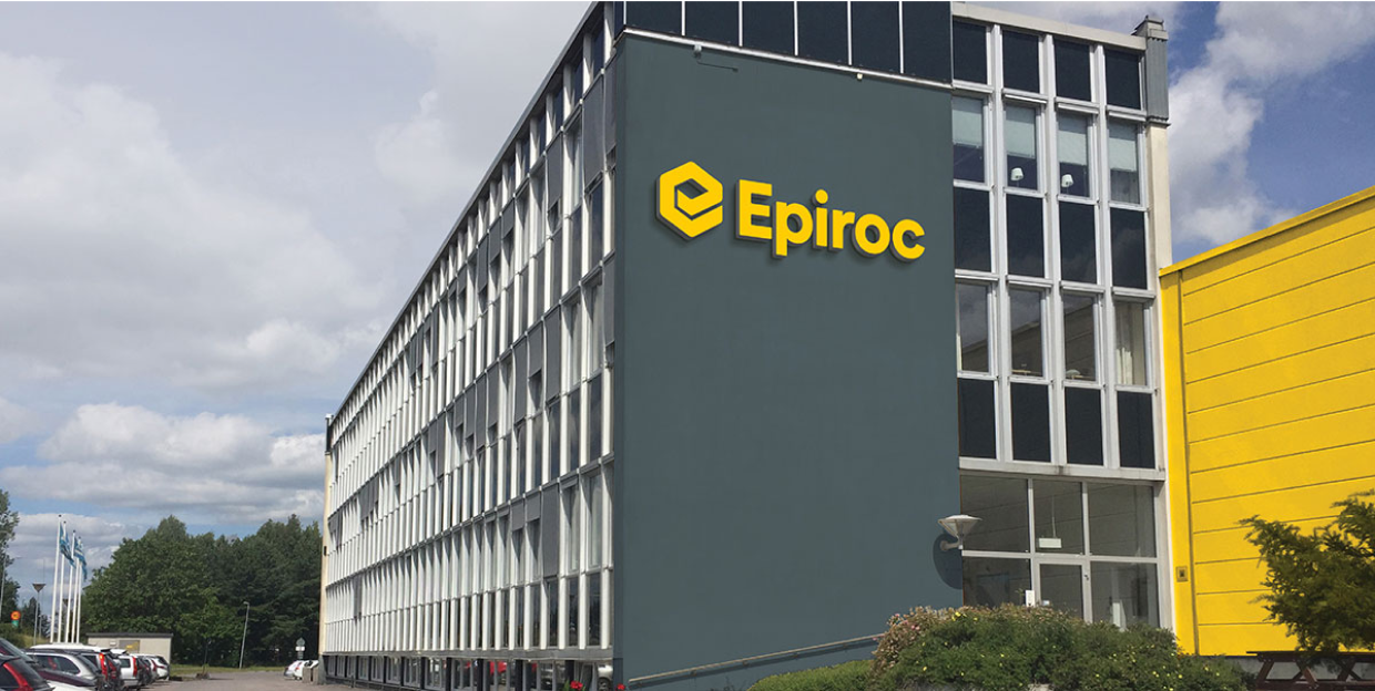 Gray building with yellow Epiroc logo